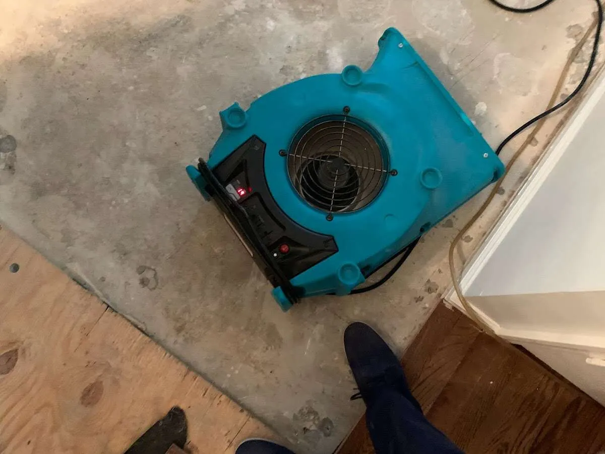 Air mover drying subfloor during Leak Detection & Repair in Volo